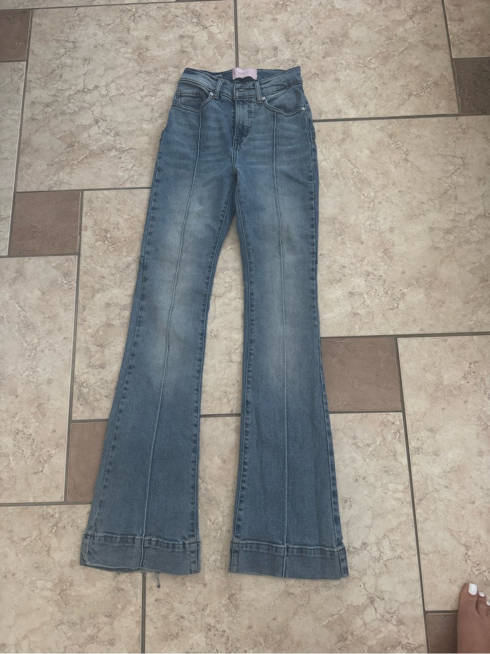 REVICE Medium Blue High-Rise Flare Jeans.